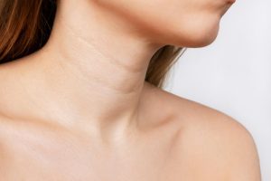 cropped shot young woman with lines her neck wrinkles creases agerelated changes
