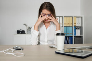 woman looking tired work because her time spent phone