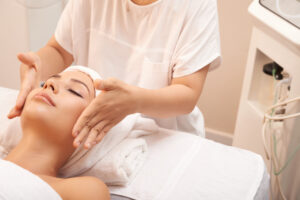 young caucasian woman getting anti age massage