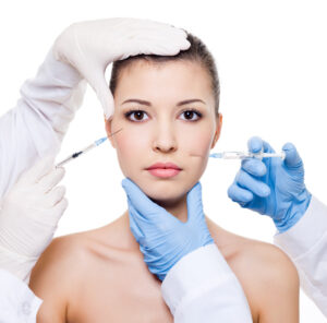 plastic surgeons giving botox injection female skin eyes lips isolated white