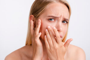 close up worried woman with white background