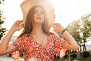 portrait young beautiful hipster girl trendy summer sundress sexy carefree woman posing street background hat sunset positive model outdoors