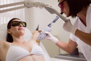 doctor performing laser hair removal patient skin 1